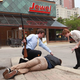 A Procter & Gamble marketing team attaches a tracking collar to an incapacitated head-of-household specimen.
